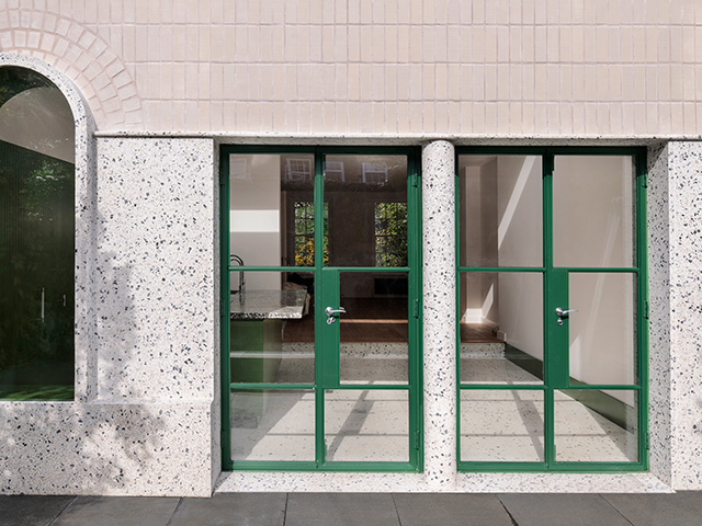 exterior of white rabbit house by gundry + drucker with green crittall doors - grand designs