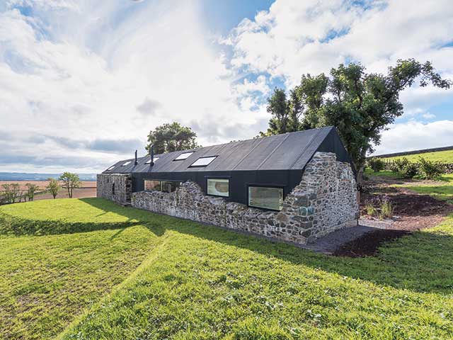Stone and waterproof EPDM farmhouse by Nathanael Dorent Architecture