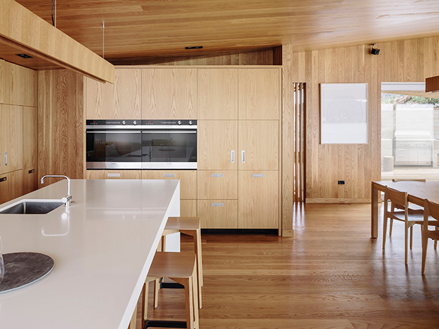 timber kitchen with bank of ovens - grand designs 