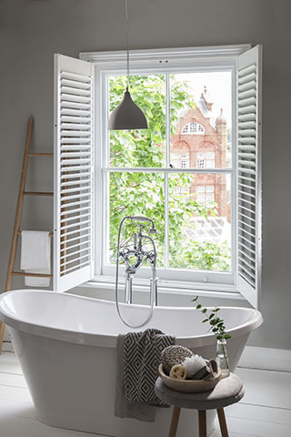 bathroom open shutters - a guide to choosing window shutters - home improvements - granddesignsmagazine.com