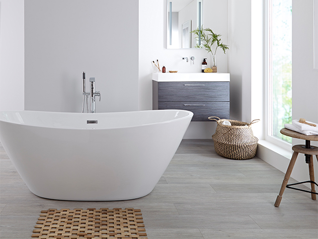 statement white bath - 5 design ideas for creating a relaxing bathroom - home improvements - granddesignsmagazine.com