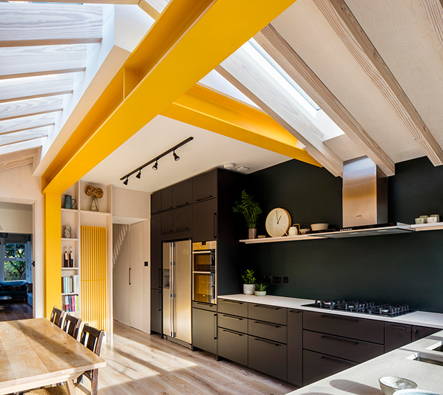 kitchen extension with yellow exposed steel beams - grand designs