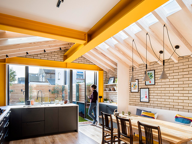 kitchen extension with yellow structural exposed beams 