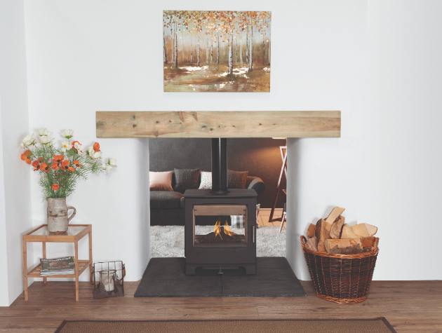 double sided stove in lounge with log basket