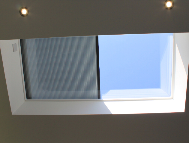 half closed roof blind on ceiling window