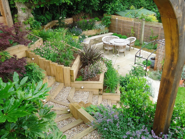 landscaped garden with steps and wooden arch