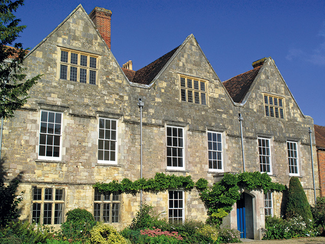 exterior of house with traditional windows and secondary glazing - grand designs - green homes grant 