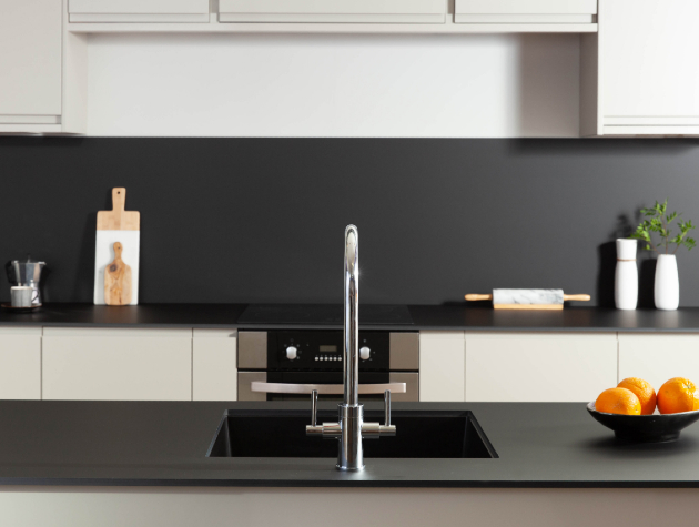 modern kitchen with island and black worktop