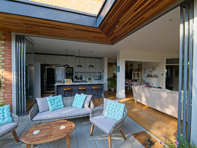 patio with folding doors leading to lounge and kitchen