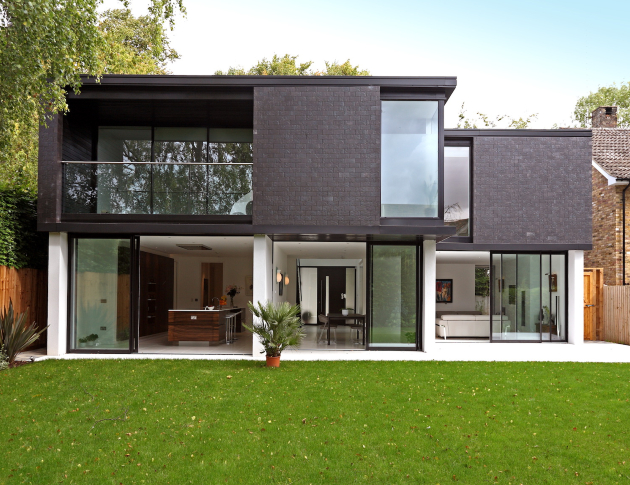 rear view of architect designed new build house with sliding doors