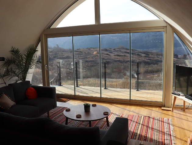 view through glass doors in lounge to countryside