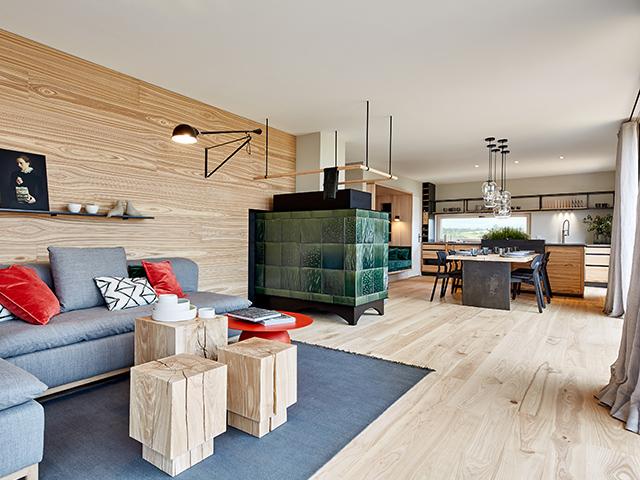 Living room of a low-energy home showing a ceramic tile clad biomass boiler