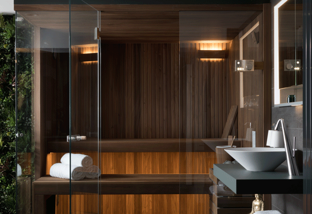 A compact corner sauna in a home spa bathroom