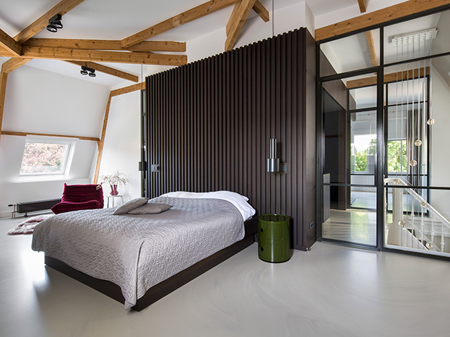 A black box architectural intervention linking the bedroom with en-suite bathroom 