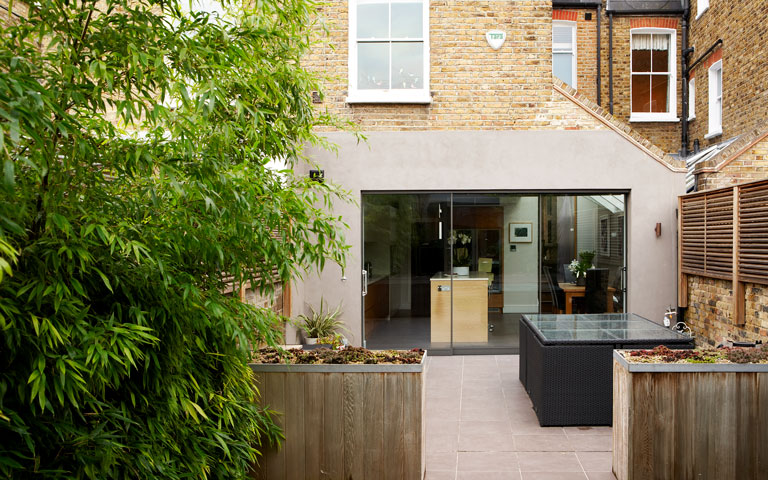 Rear exterior of Victorian house with side and rear extension