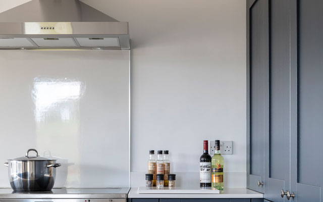 Close up of a chimney-style kitchen extractor hood