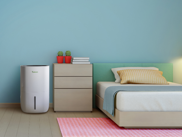 bedroom with bed drawers and dehumidifier