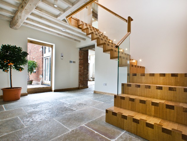 contemporary wooden staircase with glass balustrades 