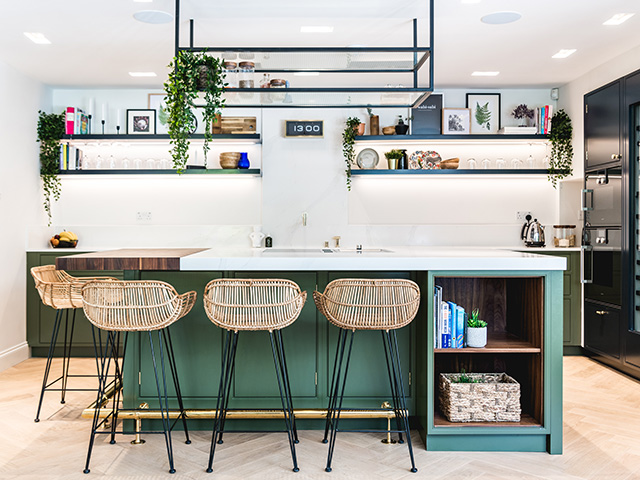 Kitchen island ideas showing a green kitchen island with metal and glass shelving suspended from the ceiling