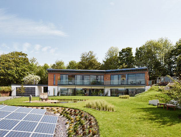 modern home exterior with garden and solar panels