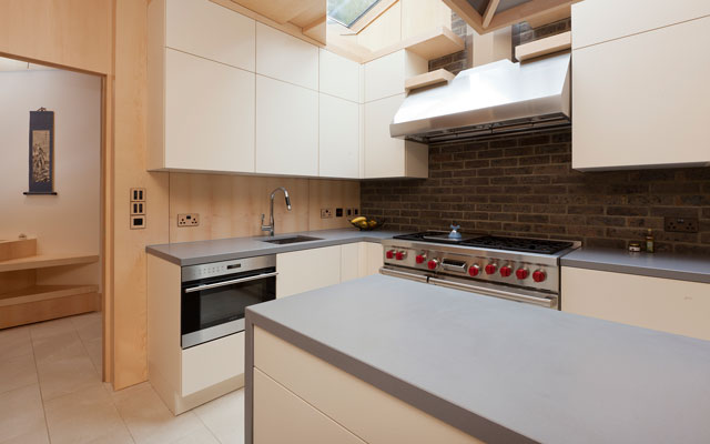 Looking down on a kitchen island with wraparound worksurface