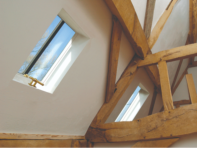 corner of room with traditional wooden beams and rooflights