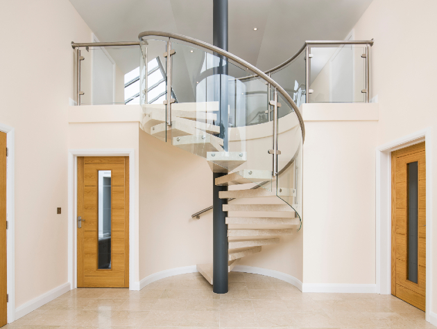 foyer with three doors and spiral staircase in centre