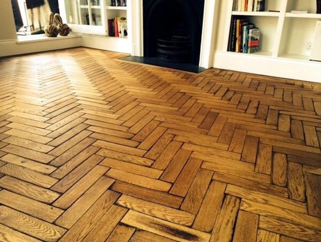 wooden floor in living room with herringbone pattern