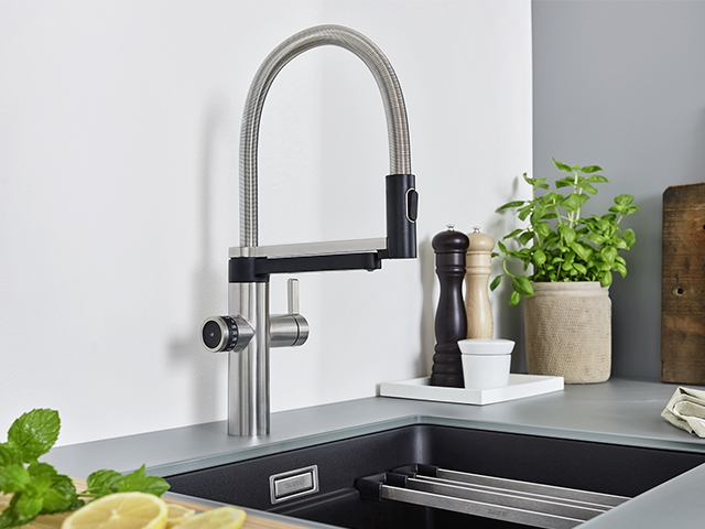 An instant hot water tap in black and chrome 