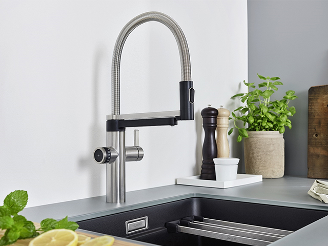An instant hot water tap in black and chrome