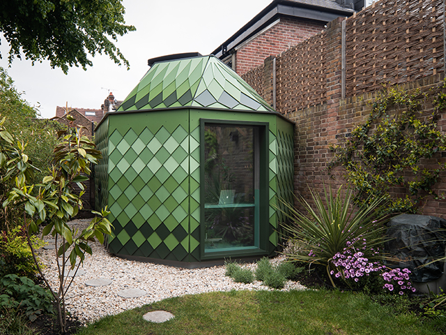 The diamond shaped cladding on the garden studio exterior