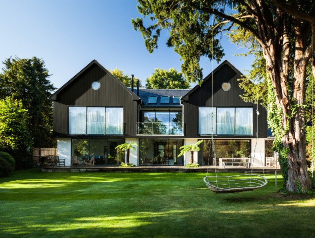 modern self build home with large gardens and swing from tree