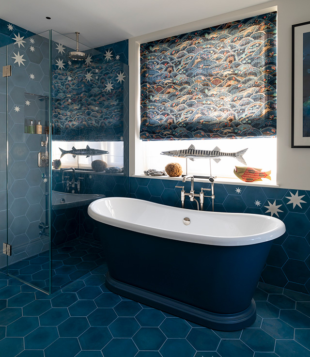 Interior design secrets os the blue bathroom with a sea scene Roman blind