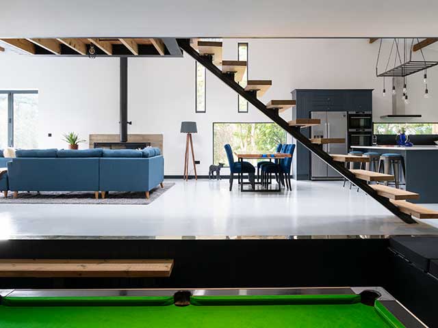 Games area with snooker table and living area underneath staircase