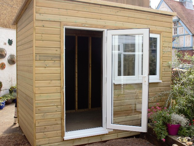 timber shed with upvc door and window