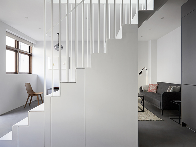 A Mata Architects staircase with a steel balustrade and built-in joinery