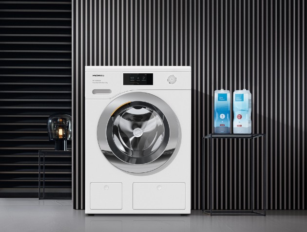White washing machine with grey walls