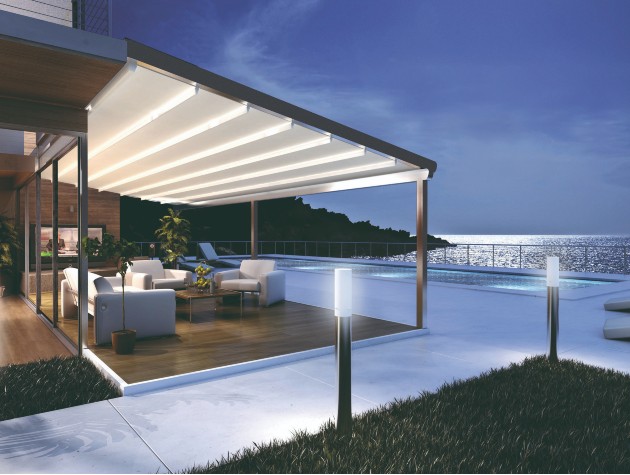 exterior of modern home in evening with pergola and pool