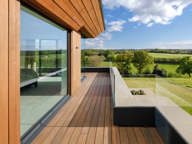 wooden decked balcony area of 1st floor of home