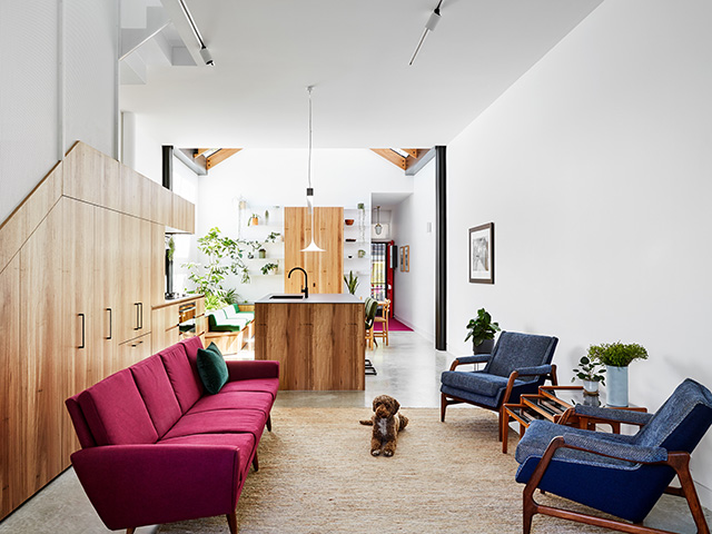 A through living room that leads to the kitchen and dining areas