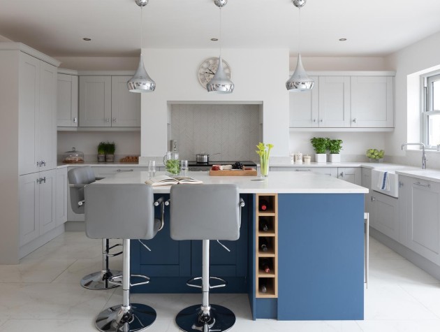 Masterclass Kitchens contemporary grey kitchen with blue kitchen island incorporating wine storage grey bar stools and silver pendant lamps