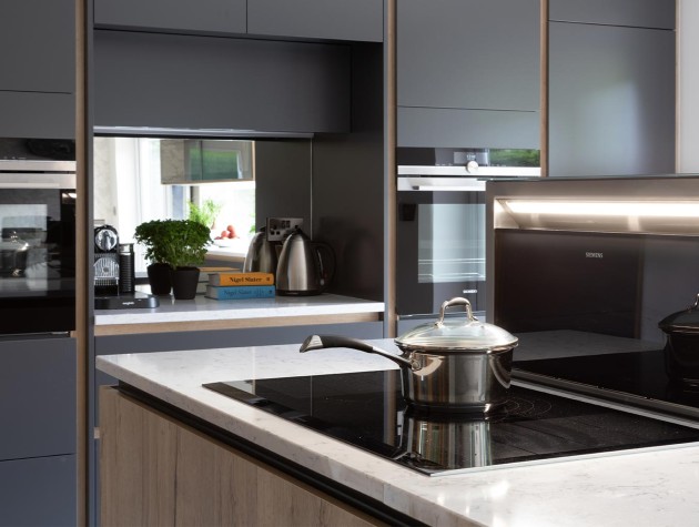 Masterclass Kitchens handleless H Line kitchen in charcoal with wood effect kitchen island and integral induction hob