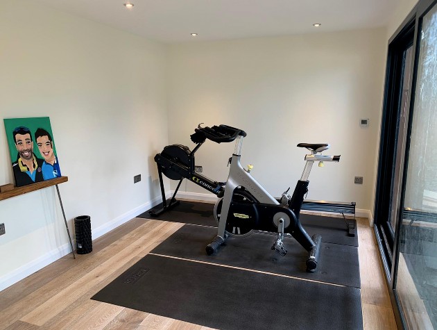 interior of garden room with exercise bike and equipment