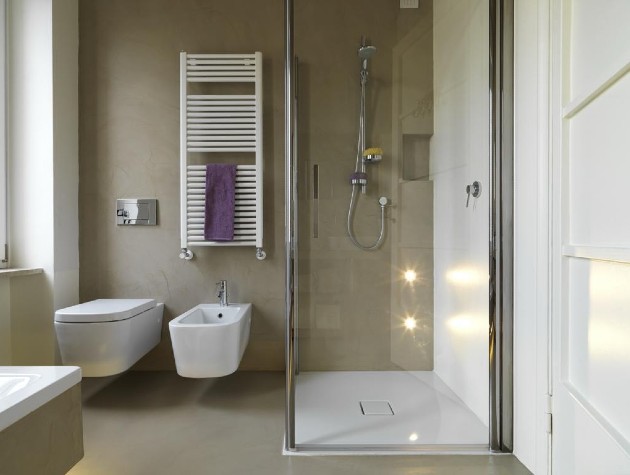 bathroom with walk in shower bidet and floating toilet