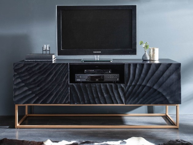 dark wood media unit with television and gold legs
