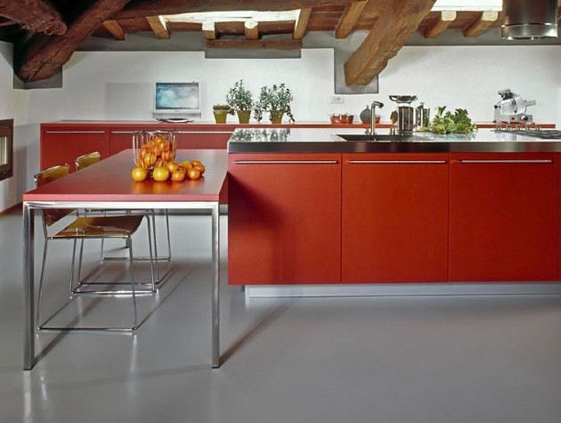 kitchen with island with red doors with red table and fruit
