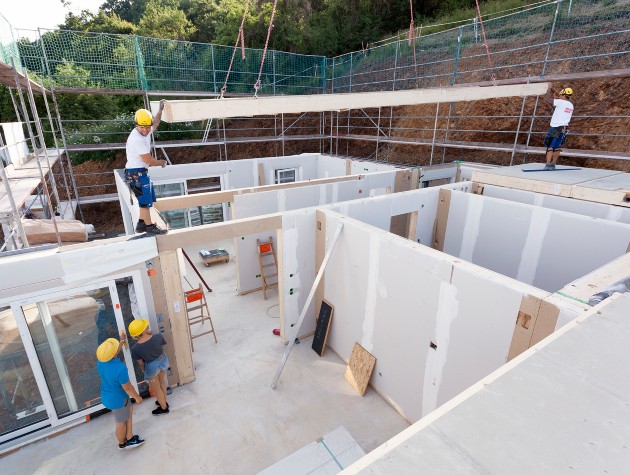 workers constructing a prefabricated house