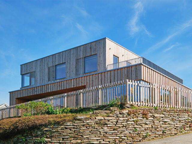 This timber-framed home by KAST Architects overlooks Cornwall’s Mawgan Porth headland