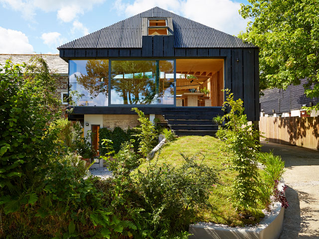 The outside of the timber cottage from Grand Designs 