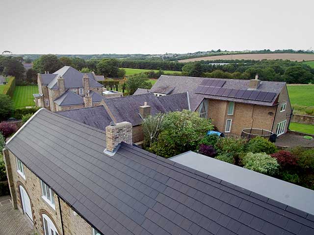 Roof tiles with solar panels in community of houses